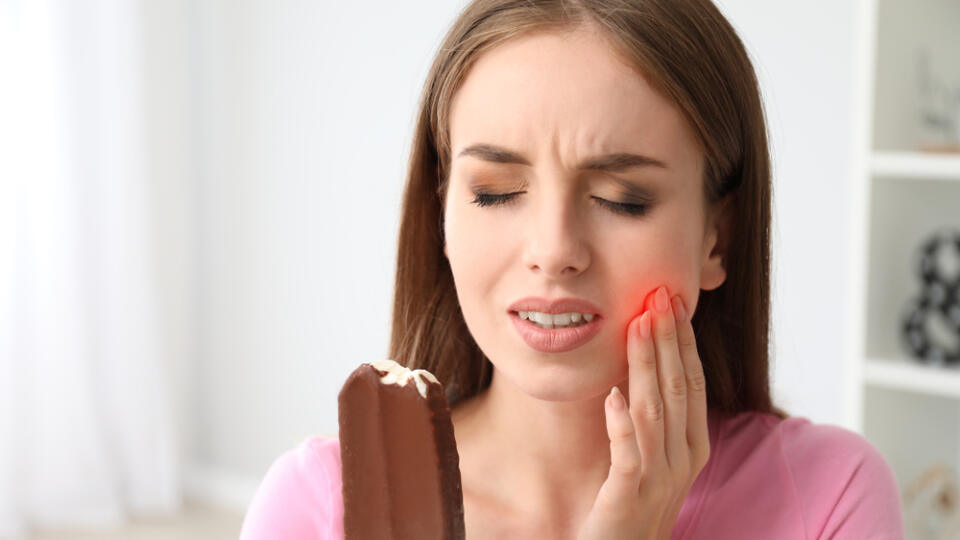 Young,Woman,With,Sensitive,Teeth,And,Cold,Ice-cream,At,Home