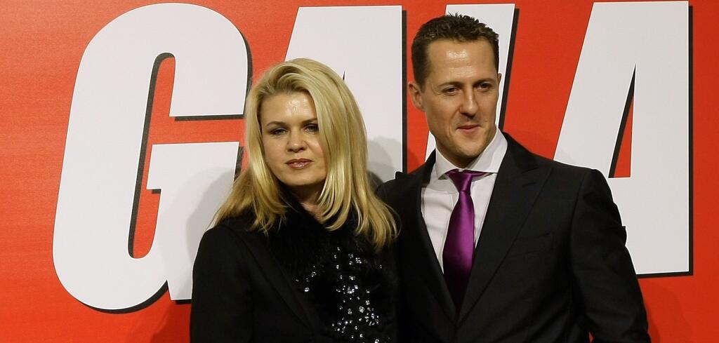 Seven-times Formula One world champion Michael Schumacher poses with his wife Corinna before receiving an award in Barcelona