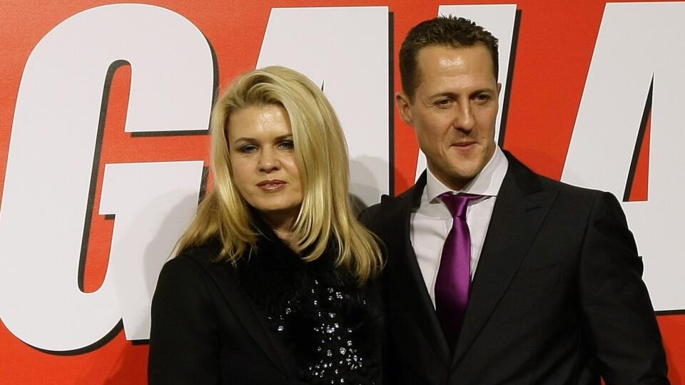 Seven-times Formula One world champion Michael Schumacher poses with his wife Corinna before receiving an award in Barcelona