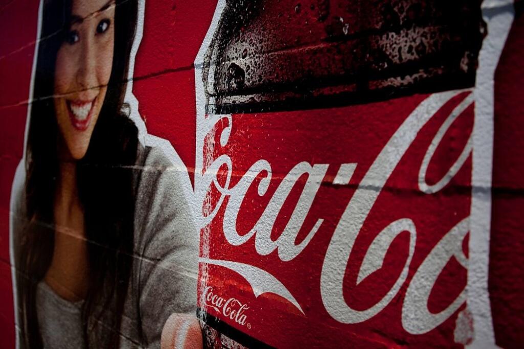 Earns Coca-Cola