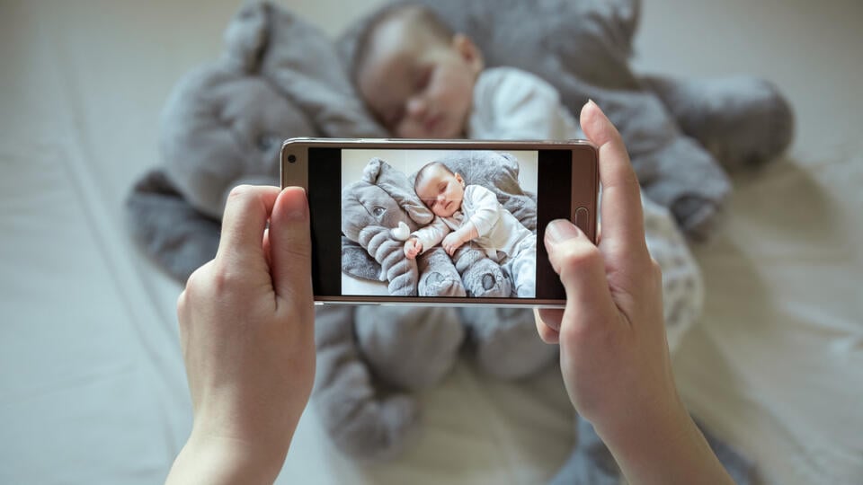 Mother,Shootin,Her,Sleeping,Newborn,Baby,By,Smartphone