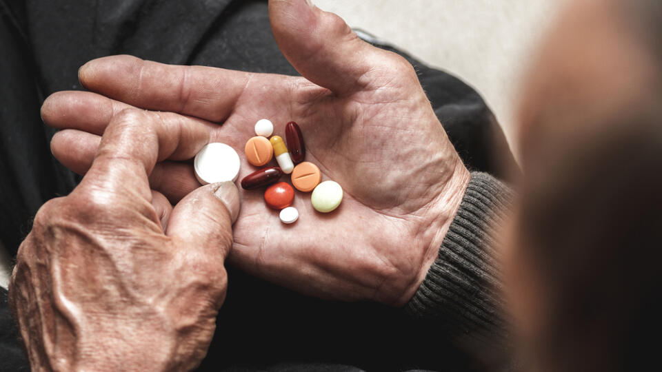 Many,Multi-colored,Pills,In,A,Senior's,Hands.,Painful,Old,Age.