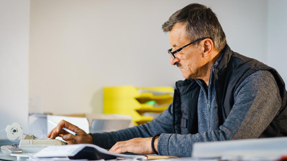 Senior,Man,Entrepreneur,At,His,Office,Store,By,The,Table