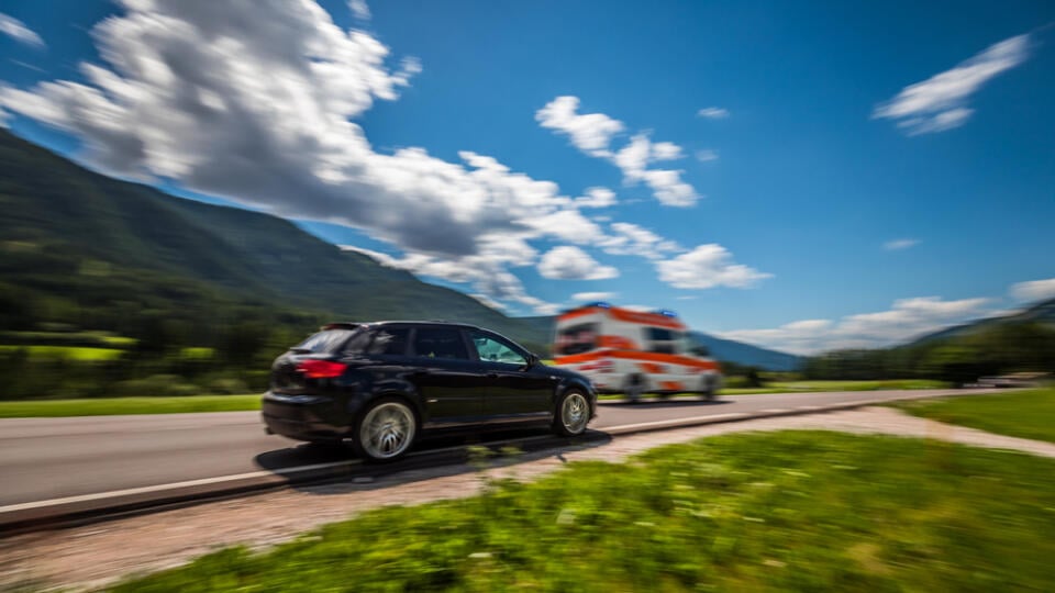 Car,At,High,Speed,Gives,Way,To,Ambulance,Road.,Warning