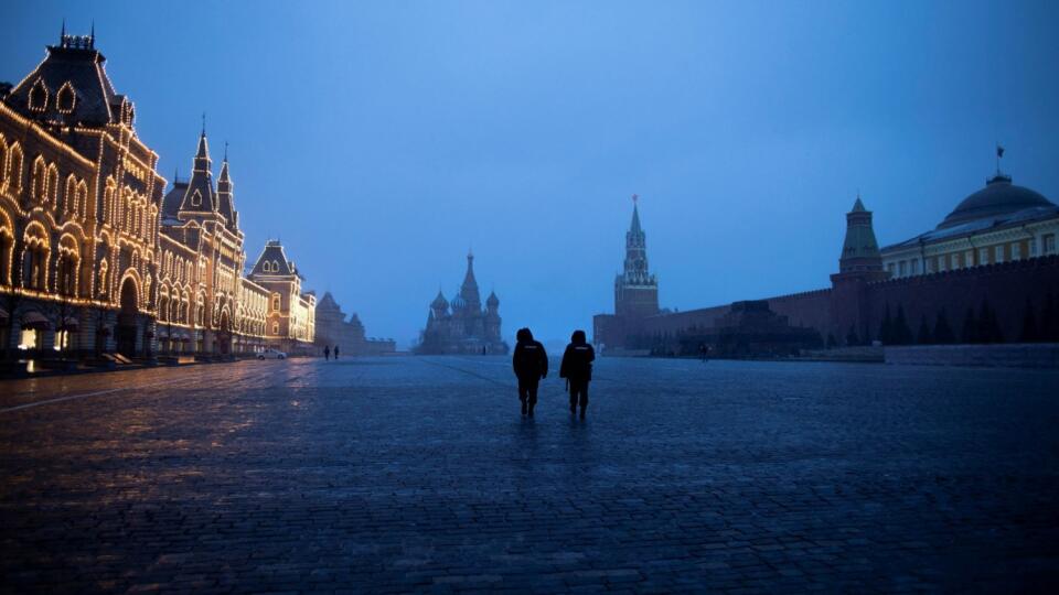 Two police officers patrol an almost empty Red Square