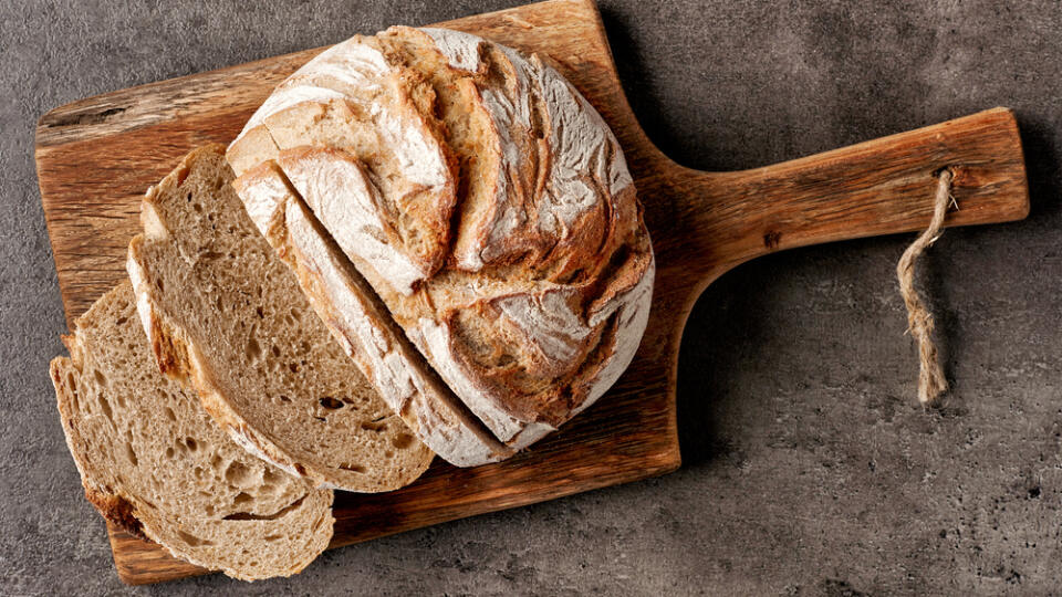 Freshly,Baked,Bread,On,Dark,Gray,Kitchen,Table,,Top,View