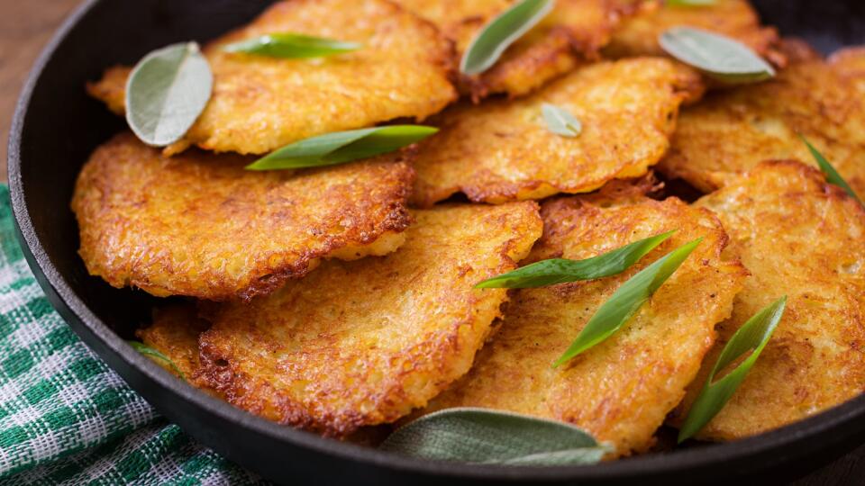 Fried potato pancakes in a frying pan