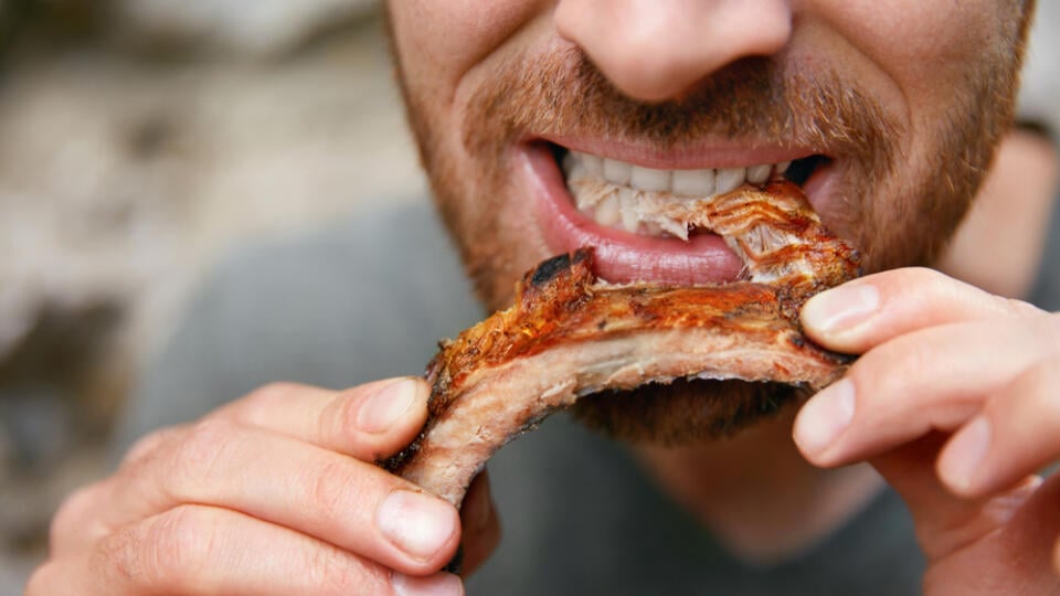 People,Eat,Food.,Man,Eating,Barbecue,Ribs,In,Grill,Bar