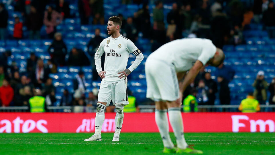 MADRID, SPAIN - JANUARY 06: Sergio Ramos (L) of Real Madrid CF and his teammate Karim Benzema (R) react as he leaves the pitch after loosing the La Liga match between Real Madrid CF and Real Sociedad de Futbol at Estadio Santiago Bernabeu on January 06, 2019 in Madrid, Spain. (Photo by Gonzalo Arroyo Moreno/Getty Images)