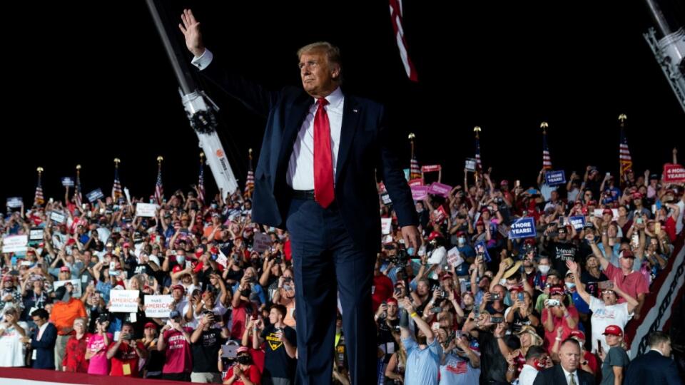 President Donald Trump waves as he walks off after speaking at a campaign rally at Orlando Sanford International Airport, Monday, Oct. 12, 2020, in Sanford, Fla.