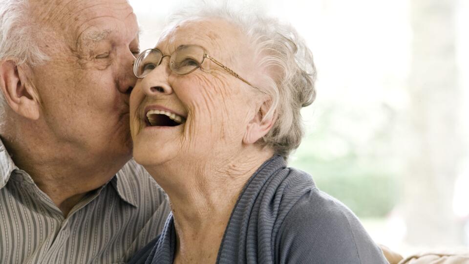 Elderly Man and Woman on Couch in Nursing Home