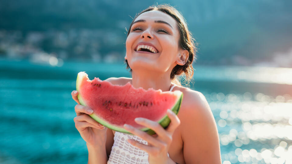 Attractive,Young,Woman,On,The,Beach,Eating,Watermelon