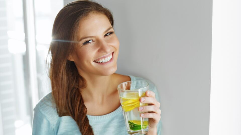 Healthy Lifestyle And Food. Woman Drinking Fruit Water. Detox.