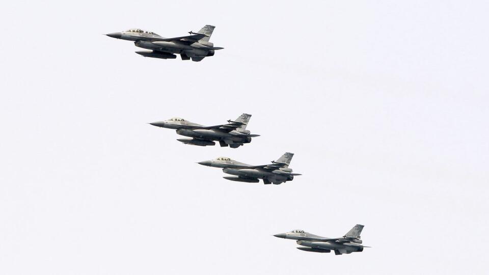Taiwan's F-16 jet fighters fly in close formation during a navy exercise in the bound of Suao naval station in Yilan County, northeast of Taiwan, Friday, April 13, 2018. Taiwan’s Armed Forces showed their capabilities of defending the Taiwan Strait with warfare involving submarine, surface ships with helicopter and Air Force strikes ahead of another drill conducted by China next week. (AP Photo/Chiang Ying-ying)