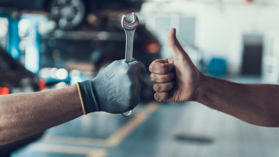 Close-up,Thumb,Up,And,Mechanics,Hand,With,Tool.,Automobile,Master