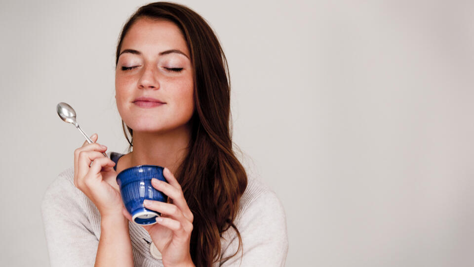 Woman,Eating,Out,Of,Small,Dish