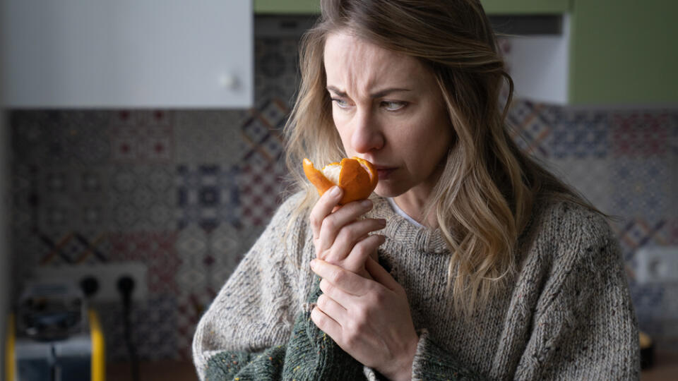 Sick,Woman,Trying,To,Sense,Smell,Of,Fresh,Tangerine,Orange,