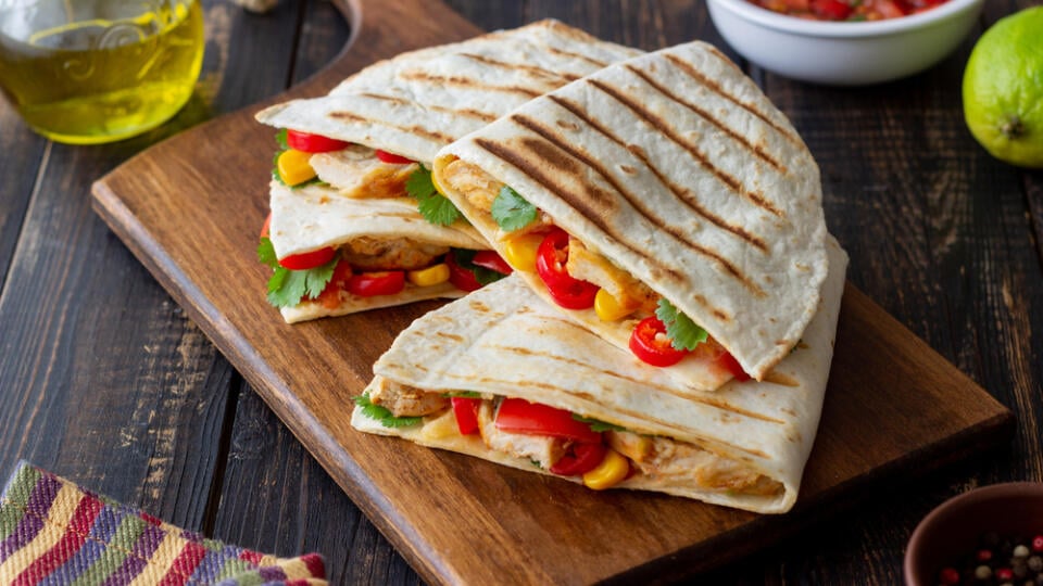 Quesadilla with chicken, tomatoes, corn, cheese and chilli. Mexican food Fast food