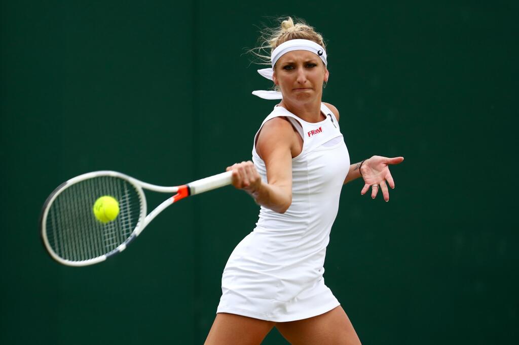 LONDON, ENGLAND - JULY 06: Timea Bacsinszky of Switzerland plays a forehand during the Ladies Singles second round match against Kristina Kucova of Slovakia on day four of the Wimbledon Lawn Tennis Championships at the All England Lawn Tennis and Croquet Club on July 6, 2017 in London, England. (Photo by Michael Steele/Getty Images)