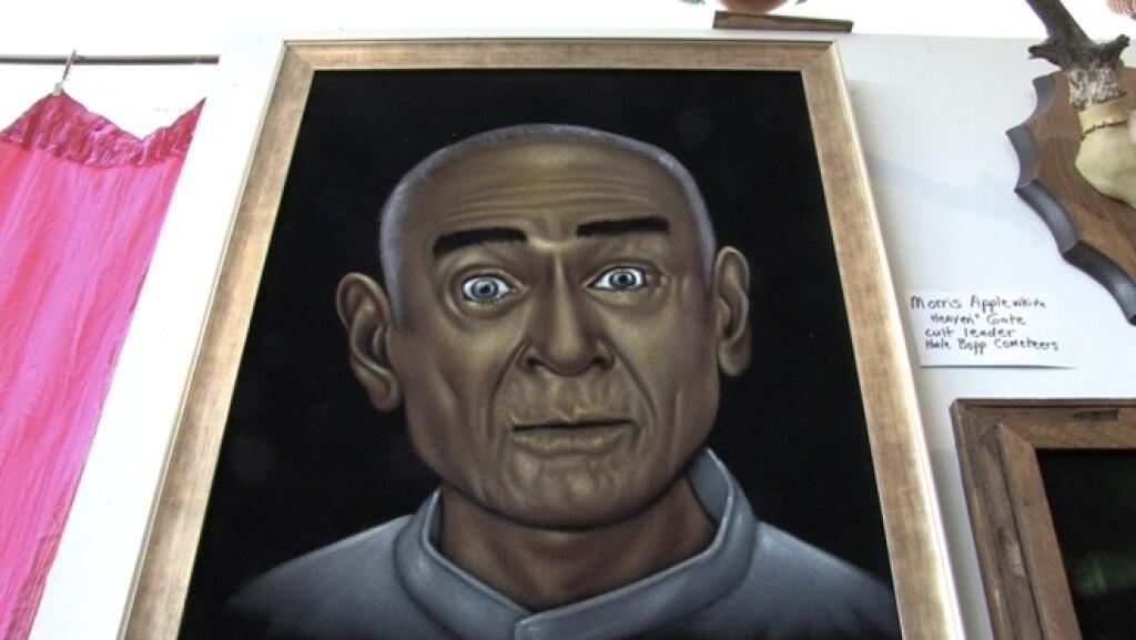 **FILE** In this April 12, 2008 file photo made from video, a velvet painting of Marshall Applewhite, the deceased leader of the Heaven's Gate group that committed mass suicide in 1997, is shown hanging in the Velveteria, the Museum of Velvet Paintings in Portland, Ore. (AP Photo/Rick Bowmer, File)